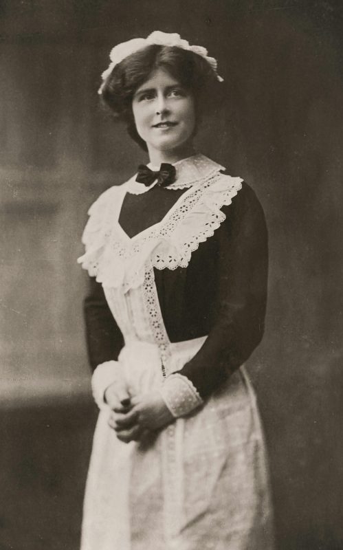 A black and white photo of a governess in the Regency era.