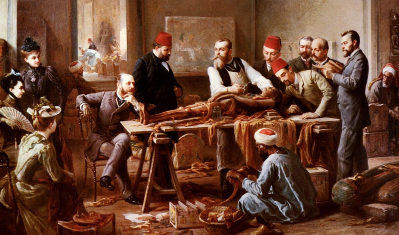 A group of men examining the skeletal remains of an Egyptian corpse.