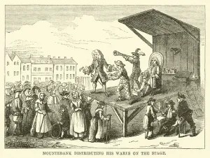 Men on stage performing before a large number of people.