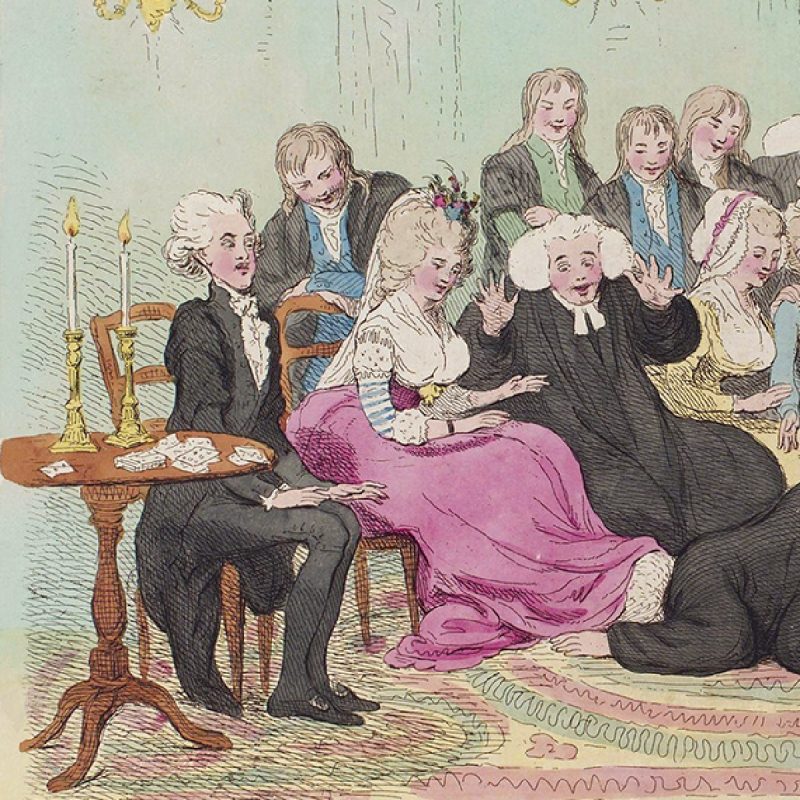 Men and women amusedly looking down at the man on the floor crawling underneath the hem of lady's long gown.