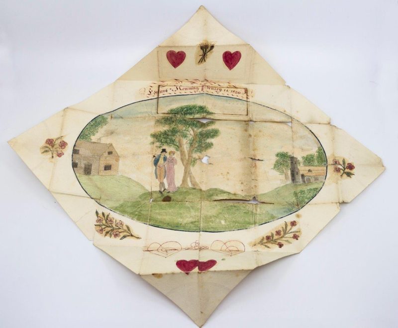 A square piece of paper with a painting of a couple under a tree in the middle of a field and flowers on all four sides of the painting.